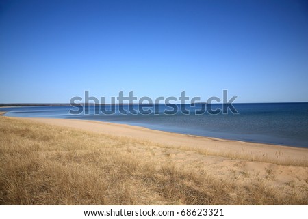 Lake Superior - Grassy shoreline and beach of a North American Great Lake.