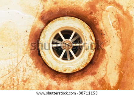 Closeup of old rusty dirty water drain