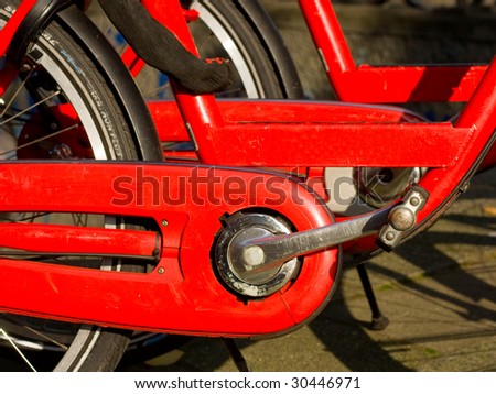 of the red bike with the pedals in a row