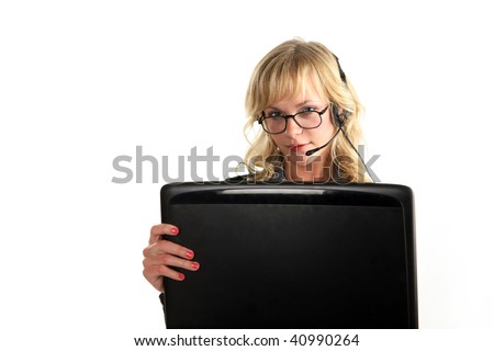 Beautiful blond woman sitting in the office chair and holding laptop with headphone and microphone over white background