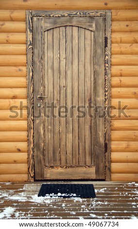 Wooden front door, winter day