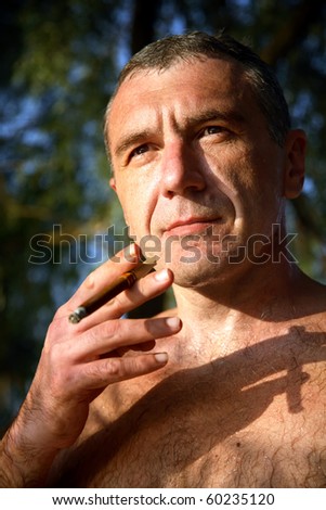naked man with a cigar, outdoor