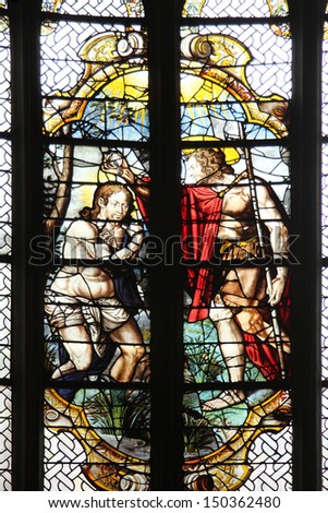 PARIS, FRANCE - NOV 07, 2012: Baptism of the Lord , stained glass, Church of St. Gervais and St. Protais, France on Nov 07, 2012