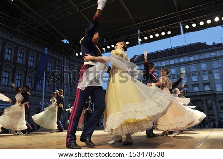 ZAGREB,CROATIA - JULY 18: Members of the ensemble song and dance Warsaw School of Economics in in old style costumes during the 47th International Folklore Festival Zagreb,Croatia on July 18,2013