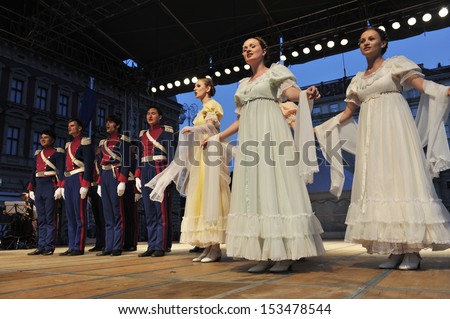 ZAGREB,CROATIA - JULY 18: Members of the ensemble song and dance Warsaw School of Economics in in old style costumes during the 47th International Folklore Festival Zagreb,Croatia on July 18,2013