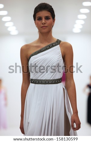 ZAGREB, CROATIA - OCTOBER 12: Fashion model in cocktail dress made by Miss B on \'Wedding Expo\' show in the Westgate Shopping City in Zagreb, Croatia on October 12, 2013