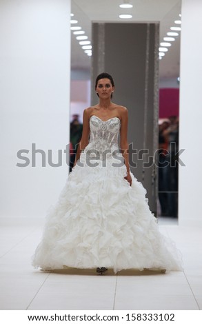 ZAGREB, CROATIA - OCTOBER 12: Fashion model in wedding dress on \'Wedding Expo\' show in the Westgate Shopping City in Zagreb, Croatia on October 12, 2013