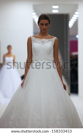 ZAGREB, CROATIA - OCTOBER 12: Fashion model in wedding dress made by Lisa and Maggie Sottero on \'Wedding Expo\' show in the Westgate Shopping City in Zagreb, Croatia on October 12, 2013