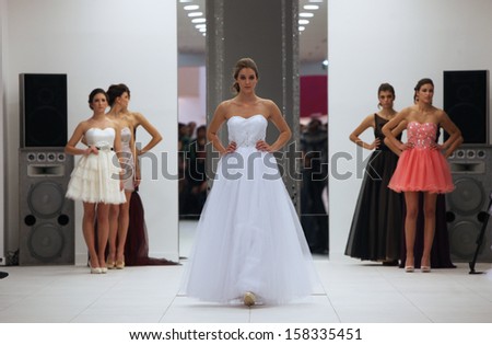 ZAGREB, CROATIA - OCTOBER 12: Fashion model in cocktail dress made by Ana Milani on \'Wedding Expo\' show in the Westgate Shopping City in Zagreb, Croatia on October 12, 2013