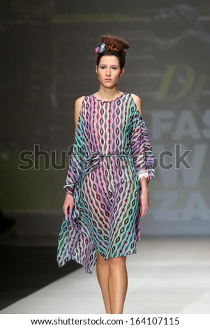ZAGREB, CROATIA - NOVEMBER 22: Fashion model wearing clothes designed by Tramp in Disguise on the Zagreb Fashion Week show on November 22, 2013 in Zagreb, Croatia.