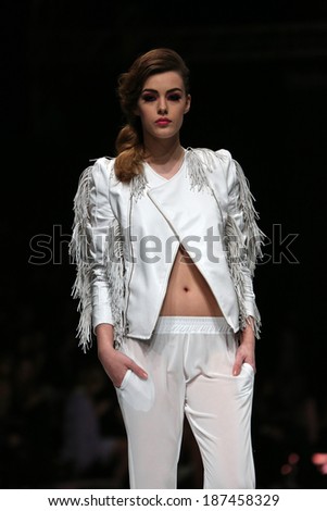 ZAGREB, CROATIA - MARCH 27: Fashion model wearing clothes designed by Krie Design on the \'Fashion.hr\' show on March 27, 2014 in Zagreb, Croatia.