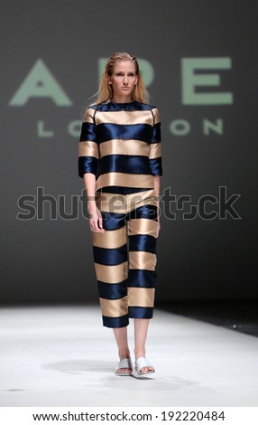 ZAGREB, CROATIA - MAY 09: Fashion model wearing clothes designed by Paper London on the Zagreb Fashion Week on May 09, 2014 in Zagreb, Croatia.
