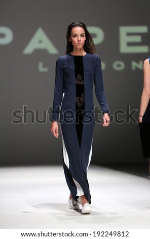 ZAGREB, CROATIA - MAY 09: Fashion model wearing clothes designed by Paper London on the Zagreb Fashion Week on May 09, 2014 in Zagreb, Croatia.