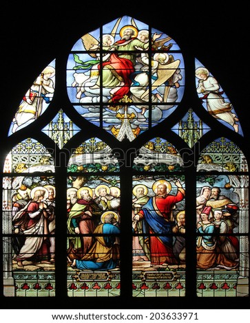 PARIS,FRANCE - NOV 11,2012:Jesus gives Peter the keys to the Kingdom, stained glass.The Church of St Severin is Catholic church in the Latin Quarter. It is one of the oldest churches on the Left Bank.