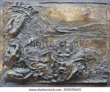 PORT AZZURRO, ELBA, ITALY - MAY 03,2014: Birth of Jesus, detail on the door of the church of St. James the Greater. The church is located inside the fort of the same name in Porto Azzurro