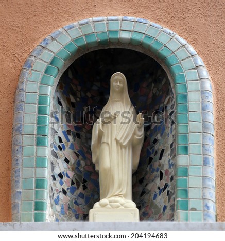 MANAROLA, ITALY - MAY 02: one of the Cinque Terre villages, UNESCO World Heritage Sites, religious chantry with a Madonna statue in one of the streets of the center, on May 02, 2014 in Manarola, Italy