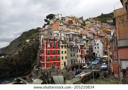 LIGURIA, ITALY - MAY 02, 2014: Riomaggiore, one of the Cinque Terre villages, UNESCO World Heritage Sites, remains a magnet for tourists to the famous Via dell\'Amore remains closed, Riomaggiore, Italy