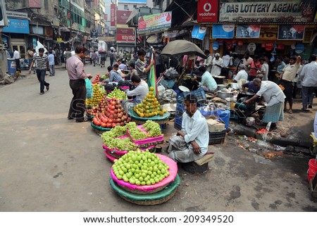 KOLKATA, INDIA - FEBRUARY 15: Street trader sell fruits outdoor on February 15, 2014 in Kolkata India. Only 0.81% of the Kolkata\'s workforce employed in the primary sector (agriculture)