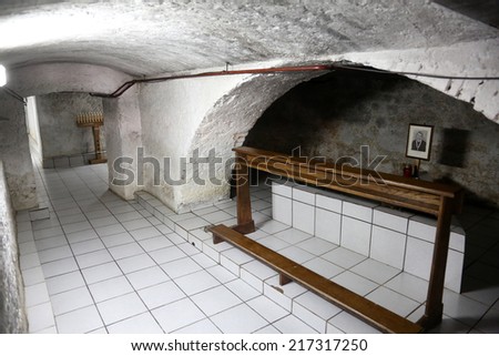 TRAVNIK, BOSNIA AND HERZEGOVINA - JUNE 11: The tomb of the Servant of God Peter Barbaric in the Church of St. Aloysius in in Travnik, Bosnia and Herzegovina on June 11, 2014.