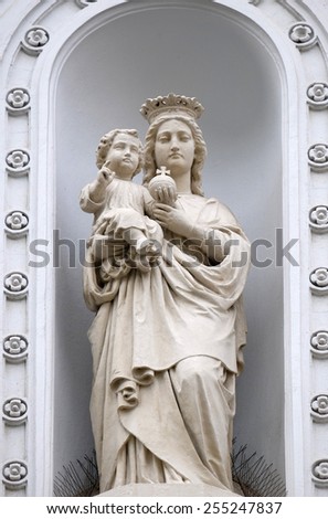 GRAZ, AUSTRIA - JANUARY 10, 2015: Virgin Mary with baby Jesus, statue on the house facade in Graz, Styria, Austria on January 10, 2015.