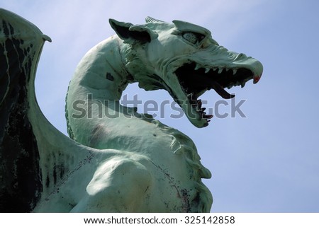 LJUBLJANA, SLOVENIA - JUNE 30: Dragon - symbol of the Slovenian capital on the Dragon Bridge in Ljubljana, Slovenia on June 30, 2015