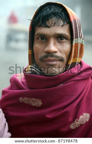 KOLKATA, INDIA - JANUARY 14: Portrait of a day laborer January 14, 2009 in Kolkata, India. These men sit on the street hoping to get day jobs not paid more than 2,5 dollars a day.