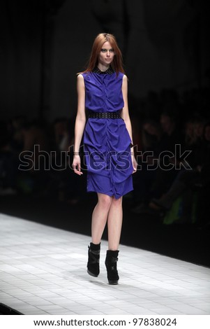 ZAGREB, CROATIA - MARCH 16: Fashion model wears clothes made by Ana Maria Ricov on \