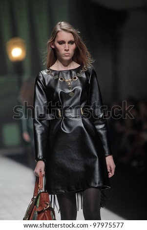 ZAGREB, CROATIA - MARCH 17: Fashion model wears clothes made by Hera by Robert Sever on 