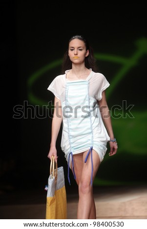 ZAGREB, CROATIA - MARCH 22: Fashion model wears clothes made by Jet Leg by Jasmina Arnautovic and Maja Virgej on \