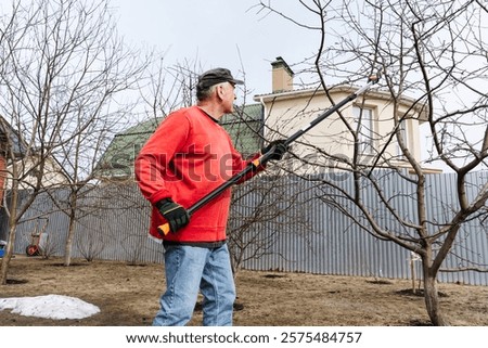 Similar – Image, Stock Photo Senior man pruning branches in back yard