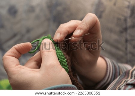 Similar – Image, Stock Photo Darned and sewn up. Torn safety net, which is makeshift patched with string.