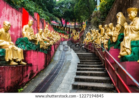 Golden Buddha statues along the stairs leading to the Ten Thousand Buddhas Monastery, Hong Kong, Sha Tin, New Territories Stok fotoğraf © 