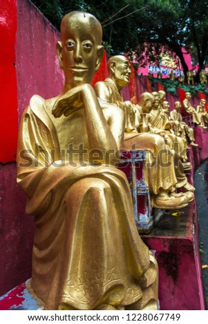 One of the Golden statues of Buddha lining the path leading to the Ten Thousand Buddhas Monastery (Man Fat Tsz), Hong Kong, Sha Tin, New Territories Stok fotoğraf © 