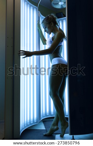 Woman getting tan in the solarium