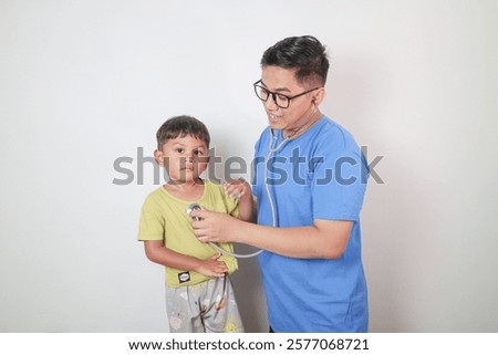 Similar – Image, Stock Photo Nurse examining little boy in clinic