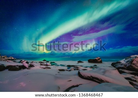Similar – Image, Stock Photo Amazing scenery of Northern lights over snowy terrain in winter