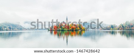 Image, Stock Photo Reflection of a church tower and houses in the water