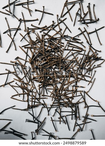 Image, Stock Photo rusty nails on the ground