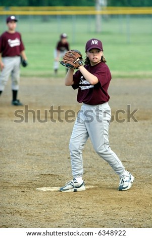 Young Girl Pitching Baseball