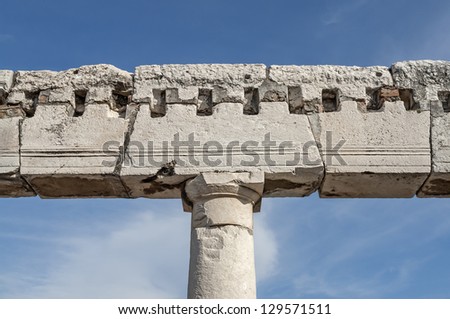 Close to a typical antique column in the ruin city Pompeji near Naples in Italy