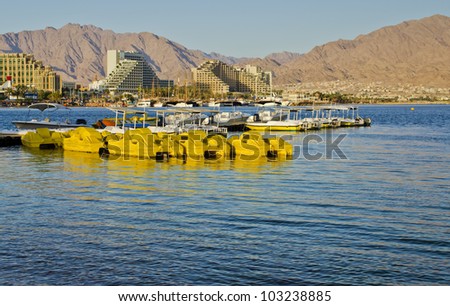 View on the Aqaba gulf (Red Sea), water sport facilities and resort hotels of Eilat, Israel