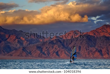Water sport at sunset, Red Sea, Israel