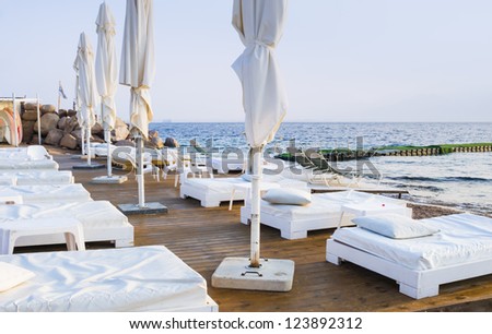 Facilities for relaxation and leisure on the southern beach of the Aqaba gulf near Eilat, Israel