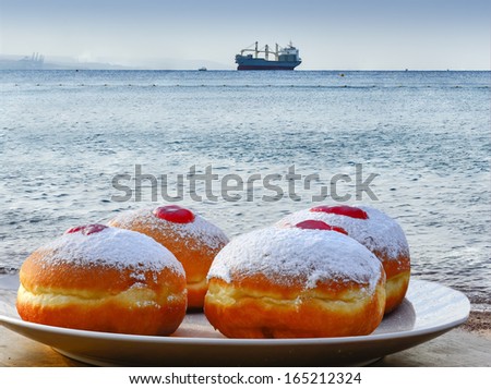 Festive donuts on background of the Red Sea, Israel