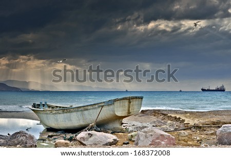 Old fishing boat cast ashore, Red Sea, Eilat, Israel