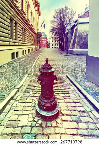Street in old Riga city, Latvia. Image toned in vintage warm colors for inspiration of retro style effect