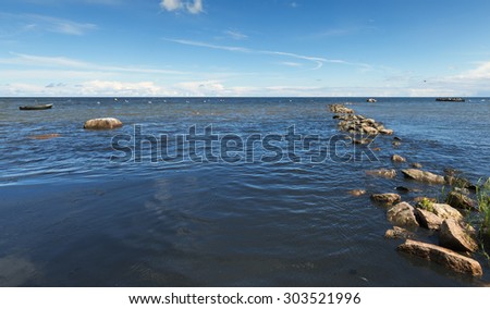 Remains of ancient pier at the Baltic Sea, Latvia. The image may be useful for ideas and concepts of ecologically clean nature, eco-tourism and weather forecast