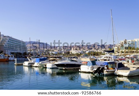 View on marina with moored yachts in Eilat – famous resort and recreation Israeli town located on northern part of the Aqaba gulf, Red Sea
