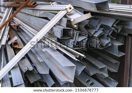 Stacks of metal profile channel piled up at a construction site in the form of scrap metal Foto d'archivio © 