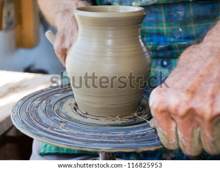 the creation of pottery on wheel